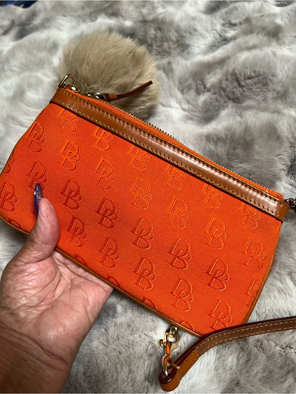 Dooney & Bourke Orange Signature Logo Wristlet with Gold Chain and Pom